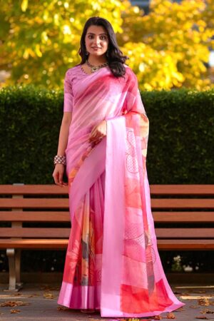 Lady in baby pink Kota cotton saree featuring vibrant floral patterns and check texture.